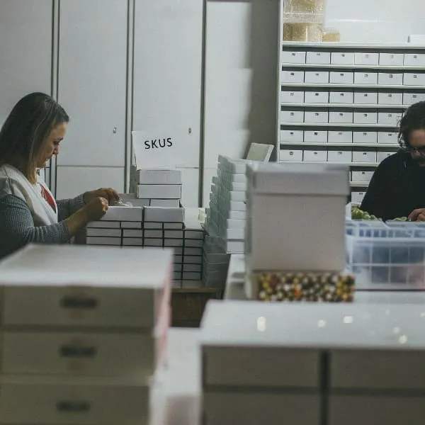 a-small-factory-scene-where-workers-are-packaging-
